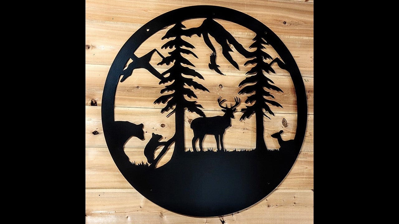 Custom black metal silhouette featuring mountains, pine tree's, a doe, a buck, an eagle, a bear, and bear cub.  