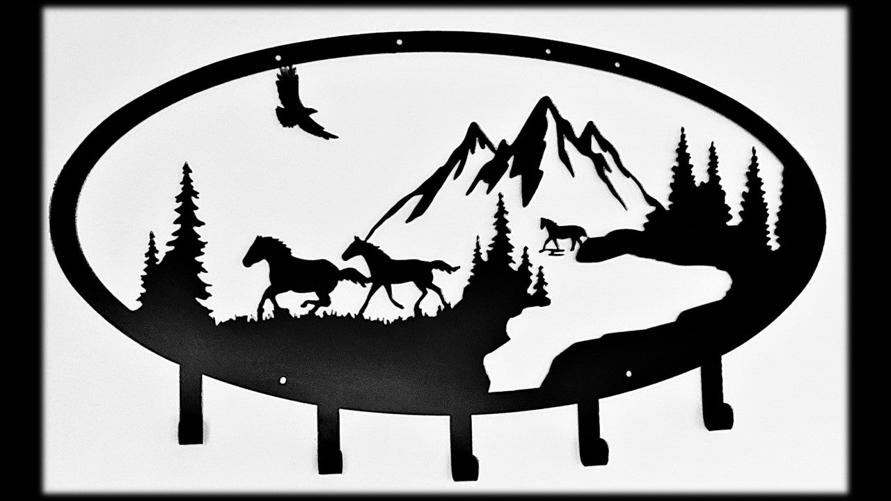 Black metal Horse style coat and hat rack featuring 3 horse's, mountains, pine tree's and an eagle with 5 hooks. 36 inches wide by 21 inches high priced at 180.00 dollars. SKU number CH18X36