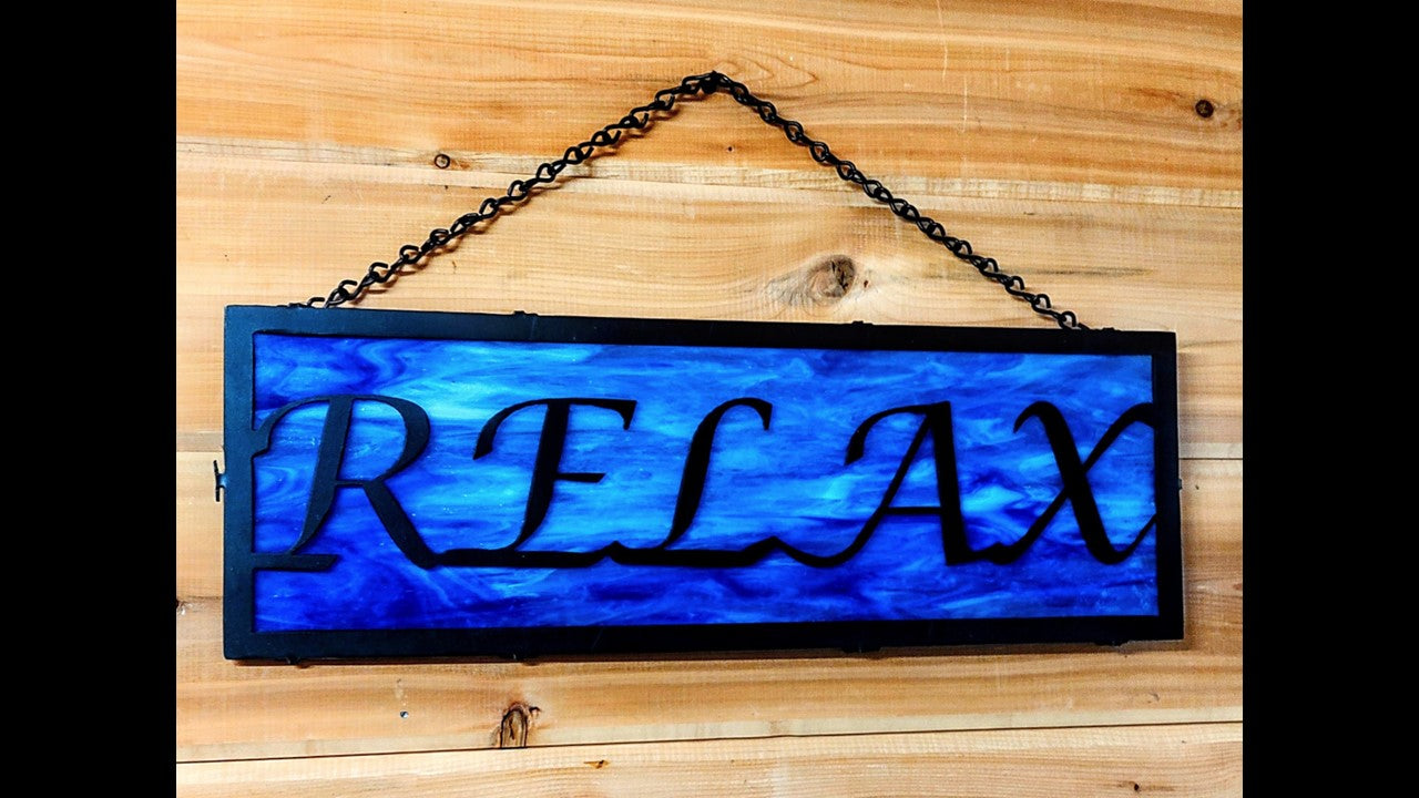 Custom black metal Relax hanging silhouette with blue stained glass