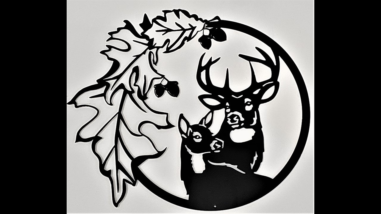 Black custom metal silhouette featuring a buck and doe heads with oak leaves to the left with acorns hanging from the leaves. 