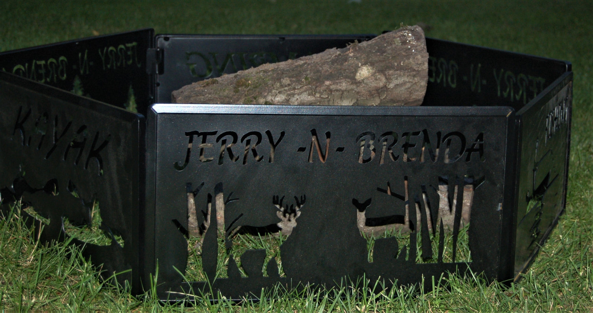 black metal Deer style inspiring assembled with logs inside of it. SKU number FRD priced at $350.00. 36" wide by 10" high. 