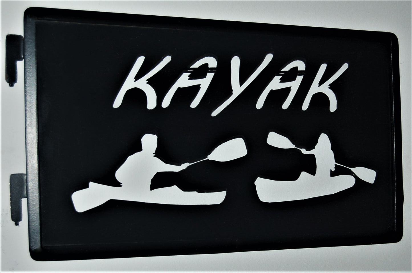 black metal Kayak inspiring panel with 2 kayaker inside of kayaks 