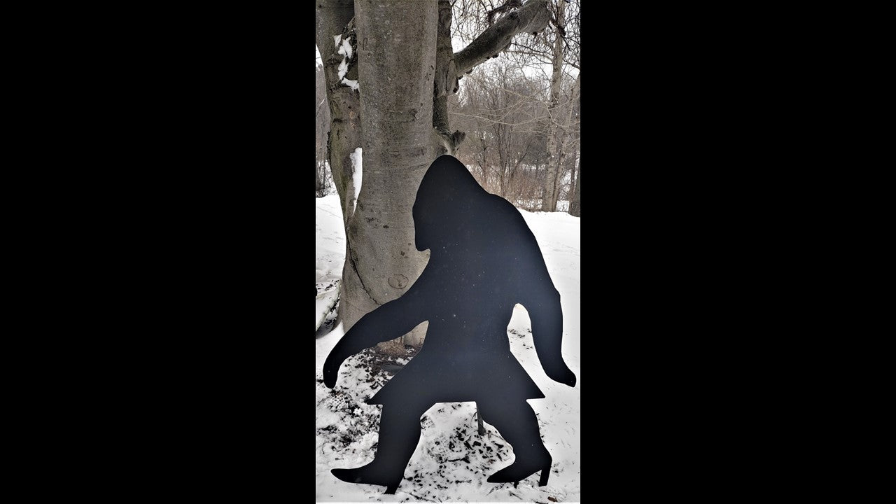 Custom black metal sasquatch lady with skirt and high heels.  42 inches tall and 32 and 1/2 inches wide. Size is customizable. 