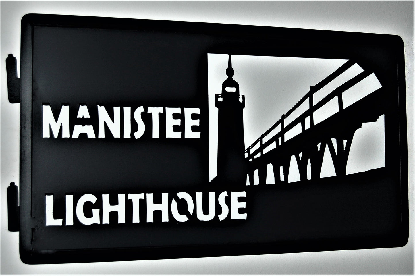 black metal Manistee lighthouse inspiring panel featuring lighthouse and bridge 