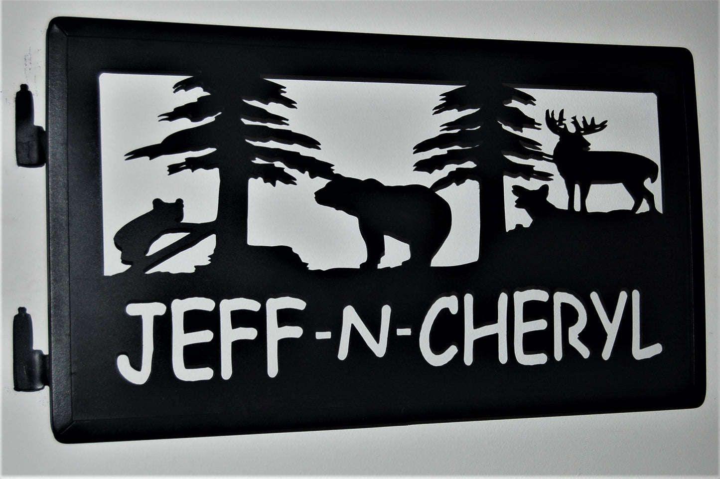 black metal Customizable bear, deer, and trees with names Jeff and Cheryl below. 